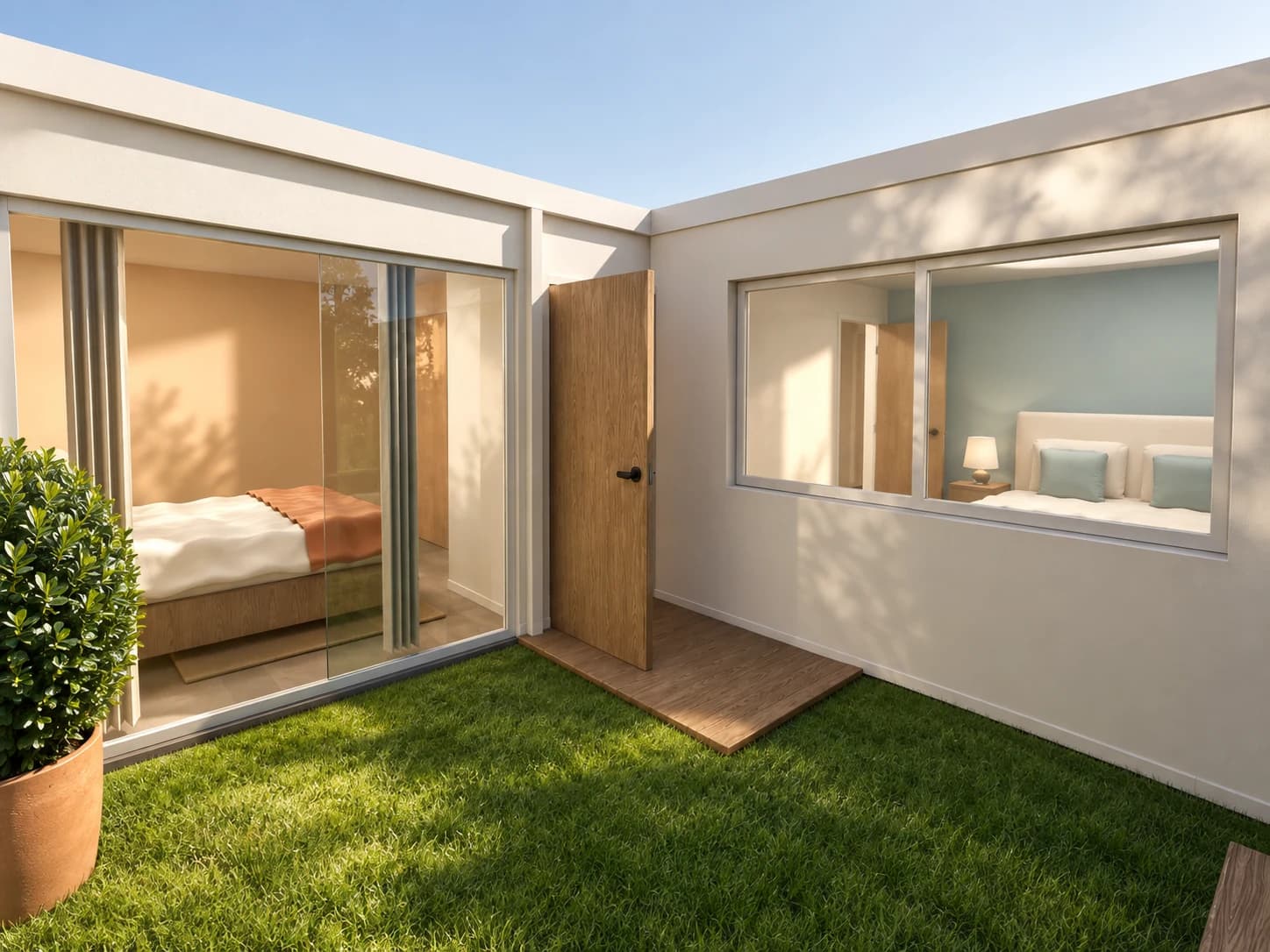 Jardin de l’appartement bordé par les baies et les fenêtres des chambres